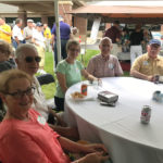 Visitors to the David Carrier classic car cruise-in enjoy food and beverages