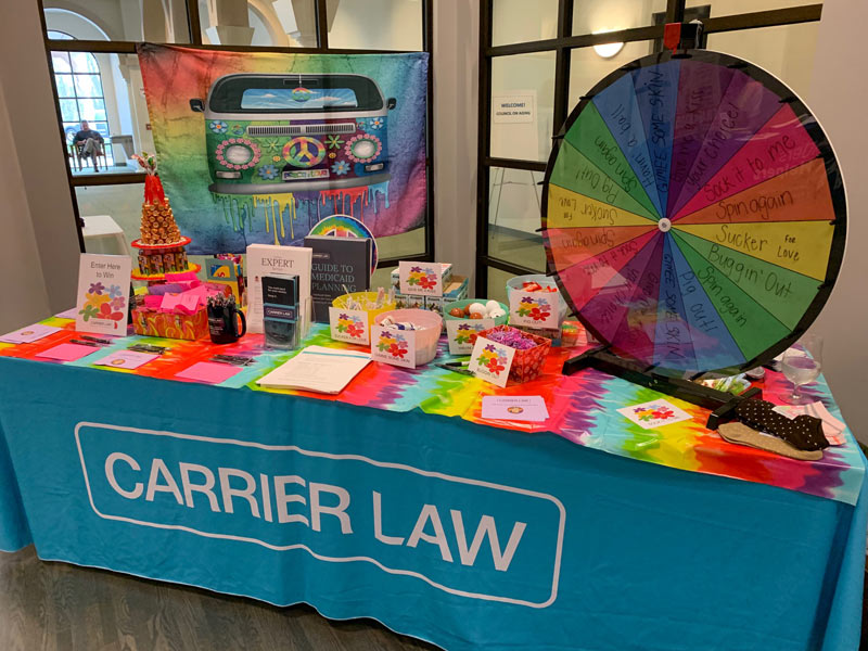 the carrier law table at the council on aging kent county's peace, love and aging conference