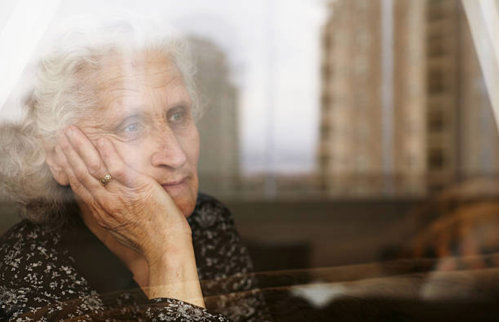 estate planning and elder law client looking out the window