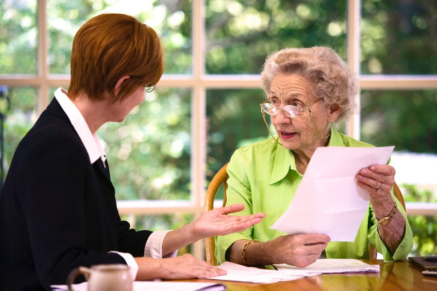 michigan elder law attorney with client discussing durable power of attorney