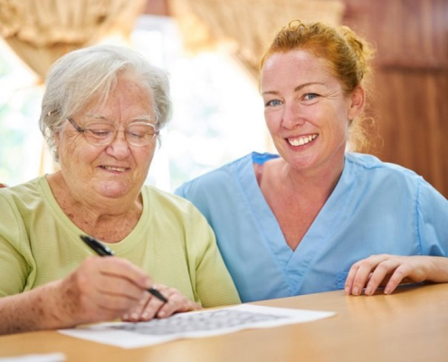 woman with nurse in skilled-nursing home facility