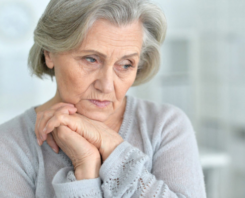 senior woman worrying about finances in her golden years